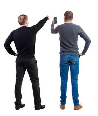Back view of two man in sweater with mobile phone. Rear view people collection. backside view of person. Isolated over white background.の写真素材