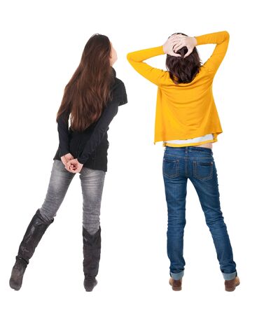 Back view of two woman in sweater. Rear view people collection. backside view of person. Isolated over white background.の写真素材