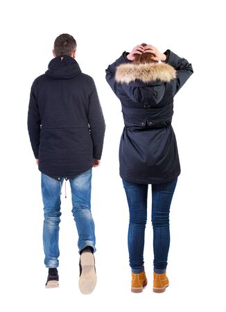 Back view of couple in winter jacket. beautiful friendly girl and guy together. Rear view people collection. backside view of person. Isolated over white background.の写真素材