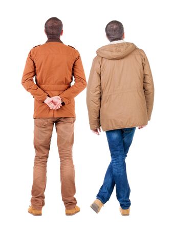 Back view of couple in winter jacket. beautiful friendly girl and guy together. Rear view people collection. backside view of person. Isolated over white background.の写真素材