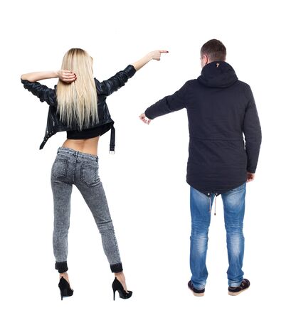 Back view of two pointing girl in winter jacket. Rear view people collection. backside view of person. beautiful woman friends showing gesture. Rear view. Isolated over white background.の写真素材
