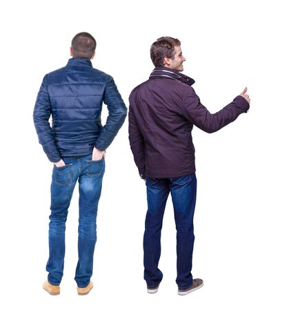 Back view of two man in winter jacket showing thumb up. Rear view people collection. backside view of person. Isolated over white background.の写真素材