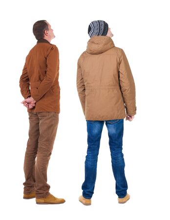 Back view of couple in winter jacket. beautiful friendly girl and guy together. Rear view people collection. backside view of person. Isolated over white background.の写真素材
