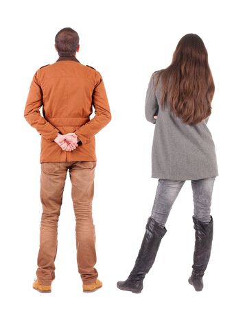 Back view of couple in winter jacket. beautiful friendly girl and guy together. Rear view people collection. backside view of person. Isolated over white background.の写真素材