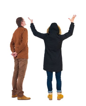 Back view of couple in winter jacket. beautiful friendly girl and guy together. Rear view people collection. backside view of person. Isolated over white background.の写真素材