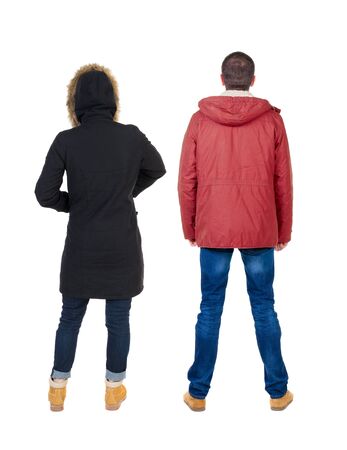 Back view of couple in winter jacket. beautiful friendly girl and guy together. Rear view people collection. backside view of person. Isolated over white background.の写真素材