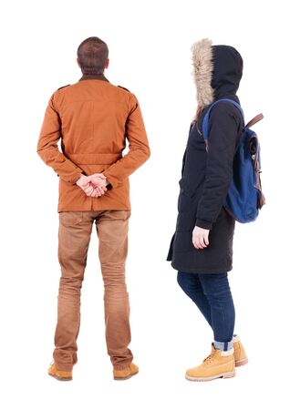 Back view of couple in winter jacket. beautiful friendly girl and guy together. Rear view people collection. backside view of person. Isolated over white background.の写真素材