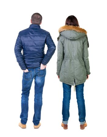 Back view of couple in winter jacket. beautiful friendly girl and guy together. Rear view people collection. backside view of person. Isolated over white background.の写真素材