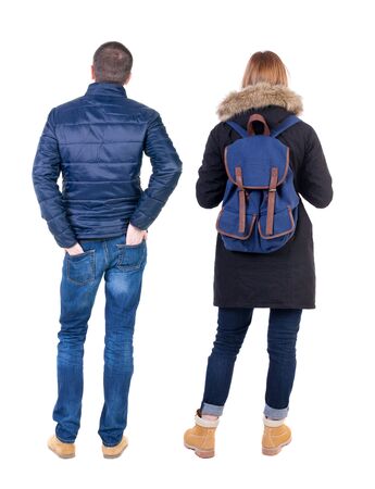 Back view of couple in winter jacket. beautiful friendly girl and guy together. Rear view people collection. backside view of person. Isolated over white background.の写真素材