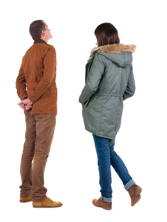 Back view of couple in winter jacket. beautiful friendly girl and guy together. Rear view people collection. backside view of person. Isolated over white background.の写真素材