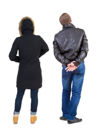 Back view of couple in winter jacket. beautiful friendly girl and guy together. Rear view people collection. backside view of person. Isolated over white background.の写真素材