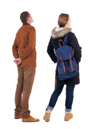 Back view of couple in winter jacket. beautiful friendly girl and guy together. Rear view people collection. backside view of person. Isolated over white background.の写真素材