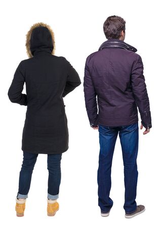 Back view of couple in winter jacket. beautiful friendly girl and guy together. Rear view people collection. backside view of person. Isolated over white background.の写真素材