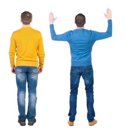 Back view of two man in sweater pointing. Rear view people collection. backside view of person. Isolated over white background.の写真素材