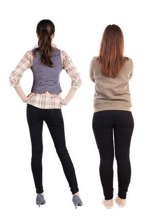 Back view of two woman in sweater. Rear view people collection. backside view of person. Isolated over white background.の写真素材