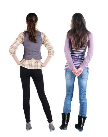 Back view of two woman in sweater. Rear view people collection. backside view of person. Isolated over white background.の写真素材