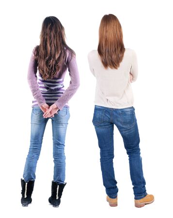 Back view of two woman in sweater. Rear view people collection. backside view of person. Isolated over white background.の写真素材
