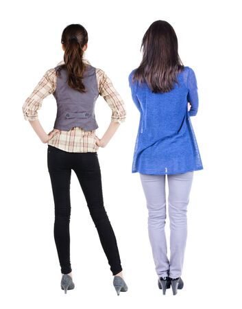 Back view of two woman in sweater. Rear view people collection. backside view of person. Isolated over white background.の写真素材