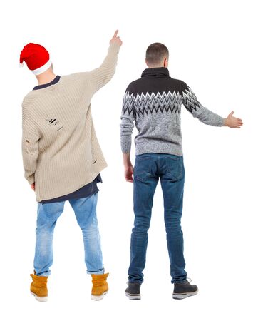 Back view of two man in sweater pointing. Rear view people collection. backside view of person. Isolated over white background.の写真素材