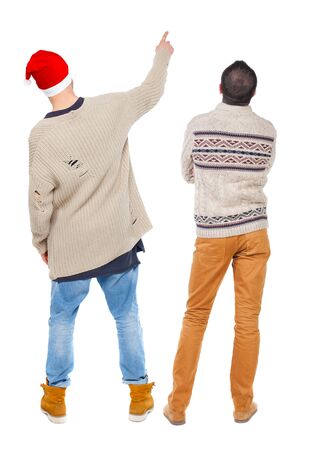 Back view of two man in sweater pointing. Rear view people collection. backside view of person. Isolated over white background.の写真素材