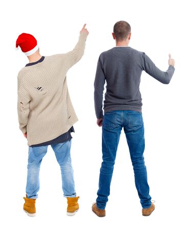 Back view of two man in sweater pointing. Rear view people collection. backside view of person. Isolated over white background.の写真素材