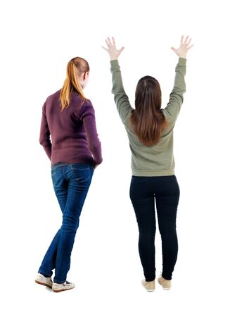 Back view of two woman in sweater. Rear view people collection. backside view of person. Isolated over white background.の写真素材