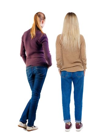 Back view of two woman in sweater. Rear view people collection. backside view of person. Isolated over white background.の写真素材