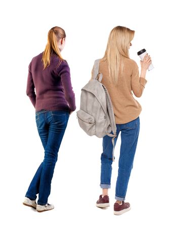 Back view of two woman in sweater. Rear view people collection. backside view of person. Isolated over white background.の写真素材