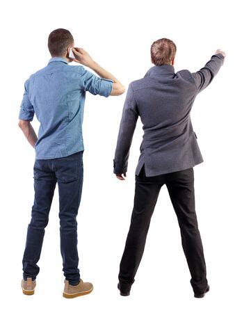 Back view of two business man in suit with mobile phone. Business team. view people collection. backside view of person. Isolated over white background.の写真素材
