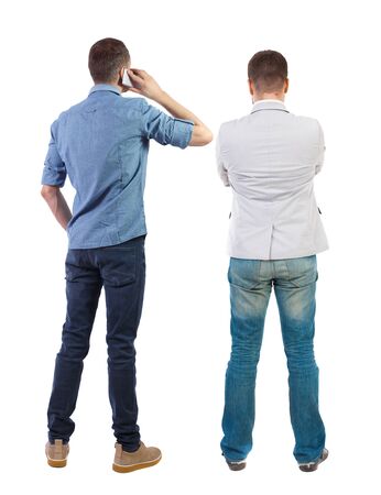 Back view of two business man in suit with mobile phone. Business team. view people collection. backside view of person. Isolated over white background.の写真素材