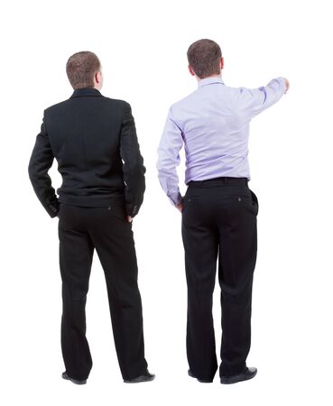 Back view of  two business men in suit pointing. Rear view people collection. backside view of person. Isolated over white background.の写真素材