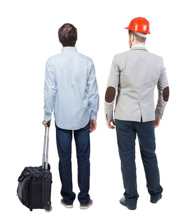 Back view of two business men in suit pointing. Business team. traveling with suitcas. Rear view people collection. backside view of person. Isolated over white background.の写真素材