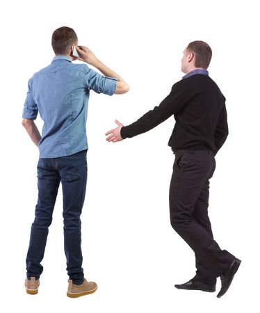 Back view of two business man in suit with mobile phone. Business team. view people collection. backside view of person. Isolated over white background.の写真素材