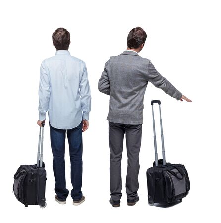 Back view of two business men in suit pointing. Business team. traveling with suitcas. Rear view people collection. backside view of person. Isolated over white background.の写真素材