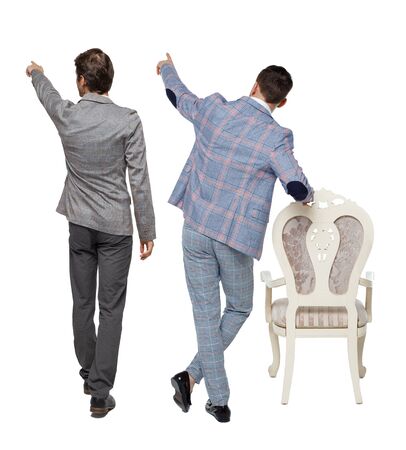 Back view of two business men in suit pointing. Rear view people collection. backside view of person. Isolated over white background.の写真素材