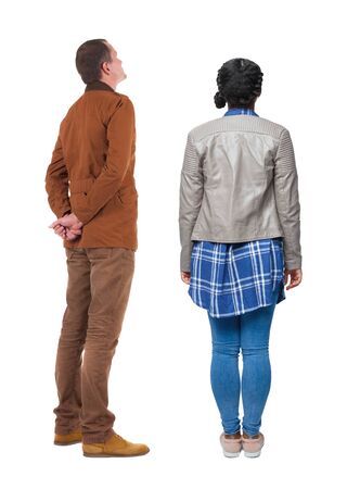 Back view of couple in winter jacket. beautiful friendly girl and guy together. Rear view people collection. backside view of person. Isolated over white background.の写真素材