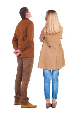 Back view of couple in winter jacket. beautiful friendly girl and guy together. Rear view people collection. backside view of person. Isolated over white background.の写真素材