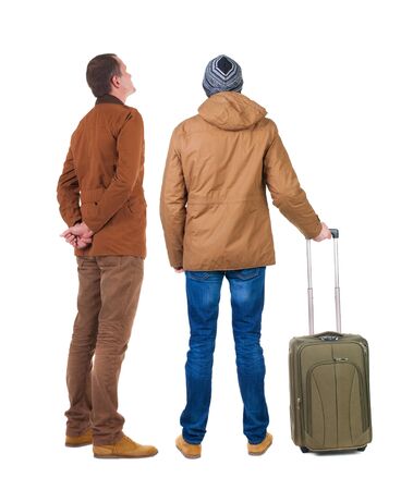 Back view of two man in winter jacket traveling with suitcas. Back view. Rear view people collection. backside view of person. Isolated over white background.の写真素材