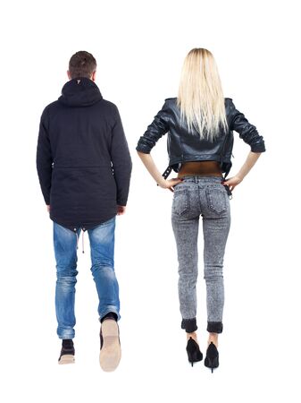 Back view of couple in winter jacket. beautiful friendly girl and guy together. Rear view people collection. backside view of person. Isolated over white background.の写真素材