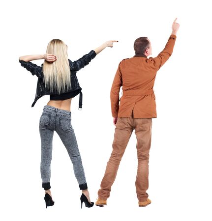 Back view of two pointing girl in winter jacket. Rear view people collection. backside view of person. beautiful woman friends showing gesture. Rear view. Isolated over white background.の写真素材