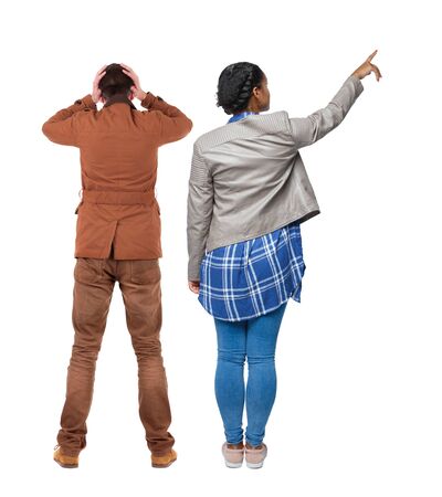 Back view of two pointing girl in winter jacket. Rear view people collection. backside view of person. beautiful woman friends showing gesture. Rear view. Isolated over white background.の写真素材
