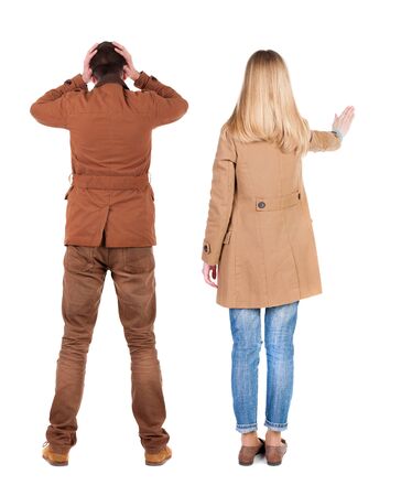 Back view of two pointing girl in winter jacket. Rear view people collection. backside view of person. beautiful woman friends showing gesture. Rear view. Isolated over white background.の写真素材