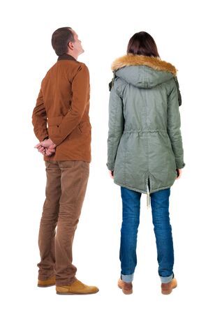 Back view of couple in winter jacket. beautiful friendly girl and guy together. Rear view people collection. backside view of person. Isolated over white background.の写真素材