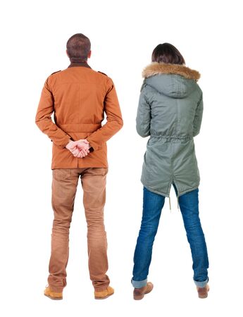 Back view of couple in winter jacket. beautiful friendly girl and guy together. Rear view people collection. backside view of person. Isolated over white background.の写真素材