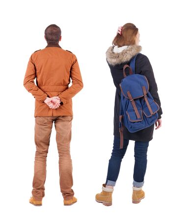Back view of couple in winter jacket. beautiful friendly girl and guy together. Rear view people collection. backside view of person. Isolated over white background.の写真素材