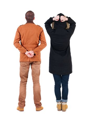 Back view of couple in winter jacket. beautiful friendly girl and guy together. Rear view people collection. backside view of person. Isolated over white background.の写真素材