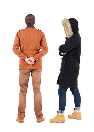 Back view of couple in winter jacket. beautiful friendly girl and guy together. Rear view people collection. backside view of person. Isolated over white background.の写真素材