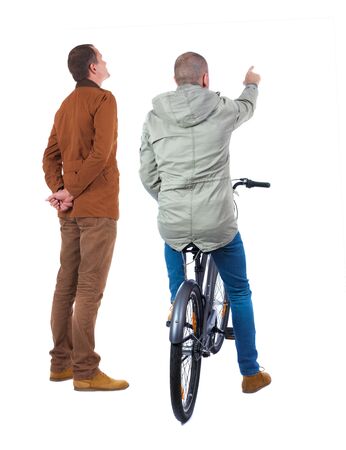 Back view of two man on a bicycle in winter jacket. Rear view people collection. backside view of person. Isolated over white background.の写真素材