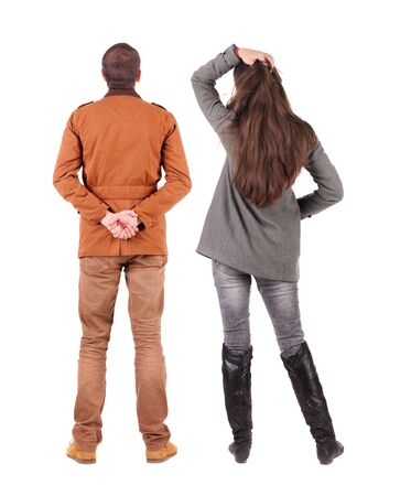 Back view of couple in winter jacket. beautiful friendly girl and guy together. Rear view people collection. backside view of person. Isolated over white background.の写真素材