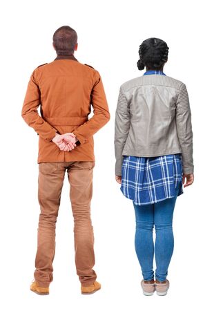 Back view of couple in winter jacket. beautiful friendly girl and guy together. Rear view people collection. backside view of person. Isolated over white background.の写真素材